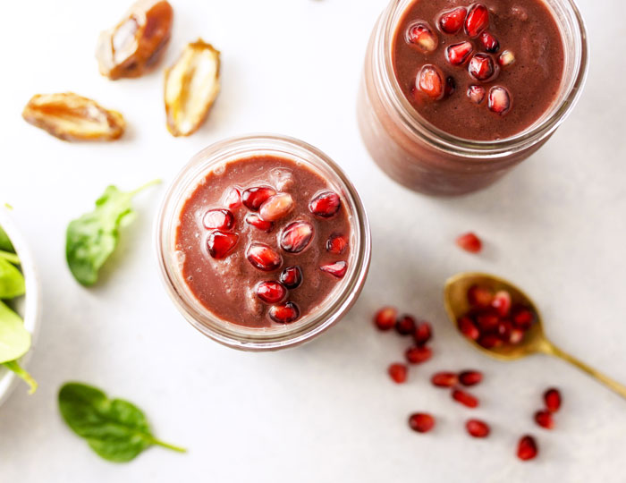 acai smoothies with pomegranate seeds on top