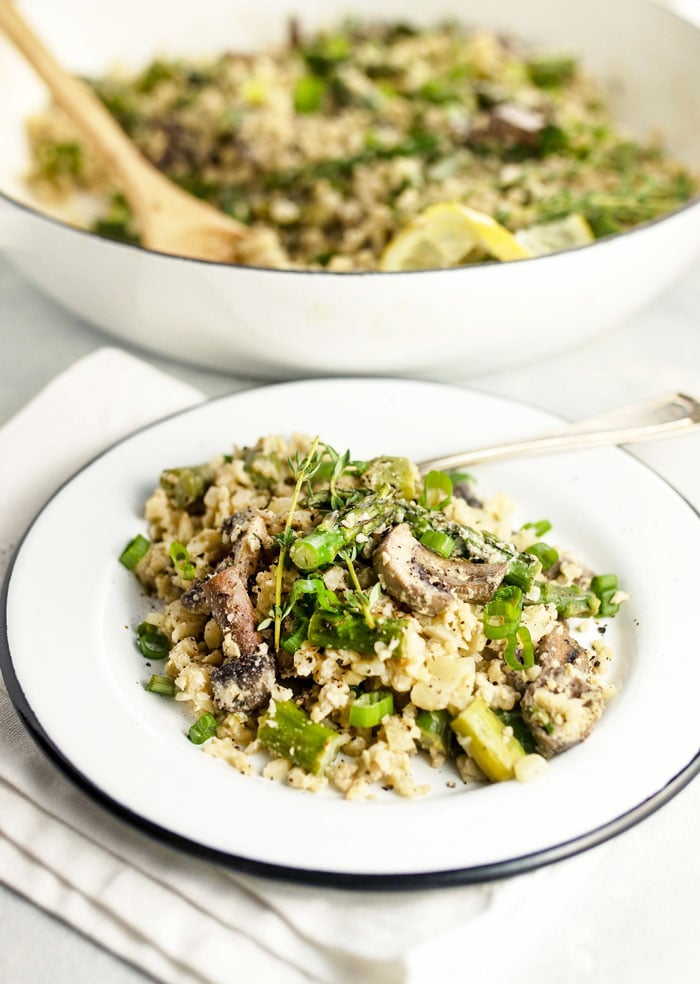 Vegan Cauliflower Rice Risotto with Asparagus and Mushrooms on a plate