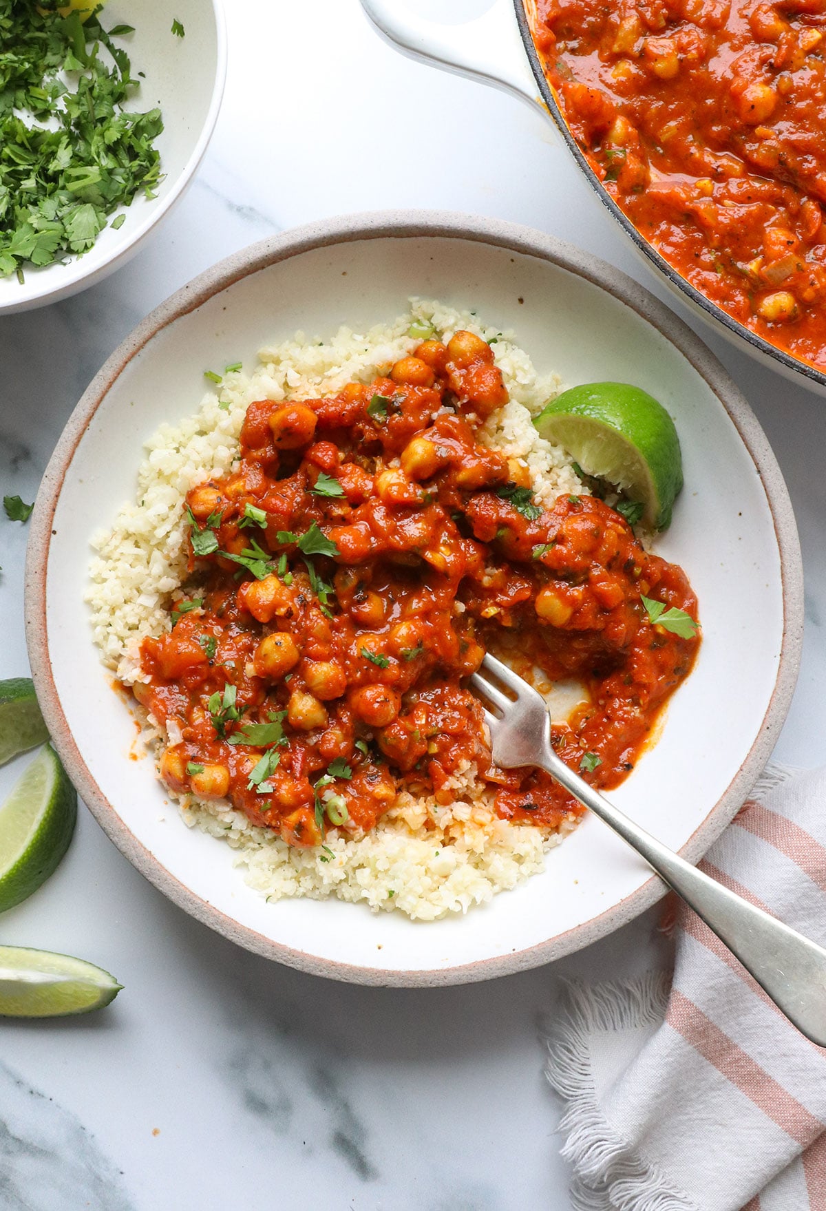 chickpea tikka masala served over cauliflower rice with cilantro. 