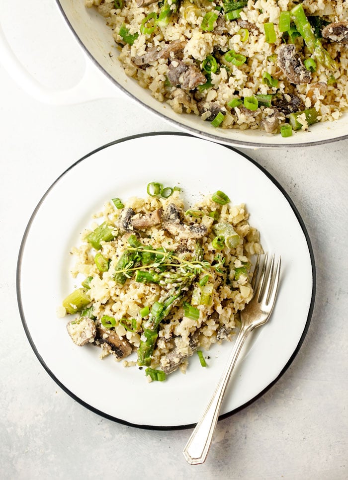 Vegan Cauliflower Rice Risotto with Asparagus and Mushrooms on a plate