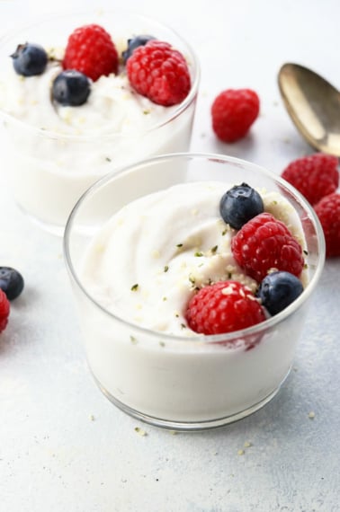 coconut milk yogurt in glass container with berries