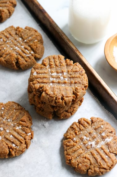 peanut butter cookies stacked on pan