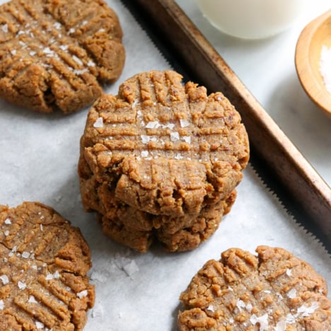 peanut butter cookies stacked on pan