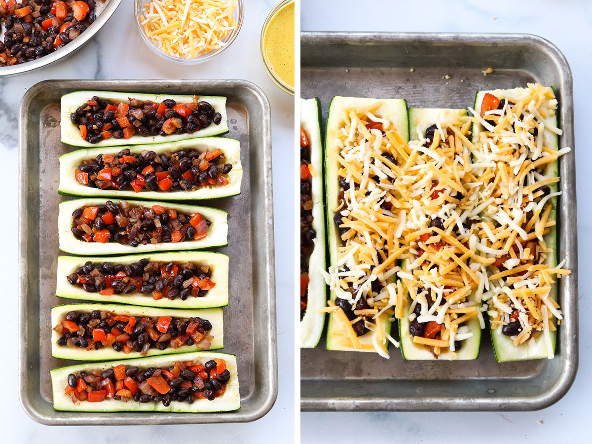 zucchini boats topped with shredded cheese before baking.