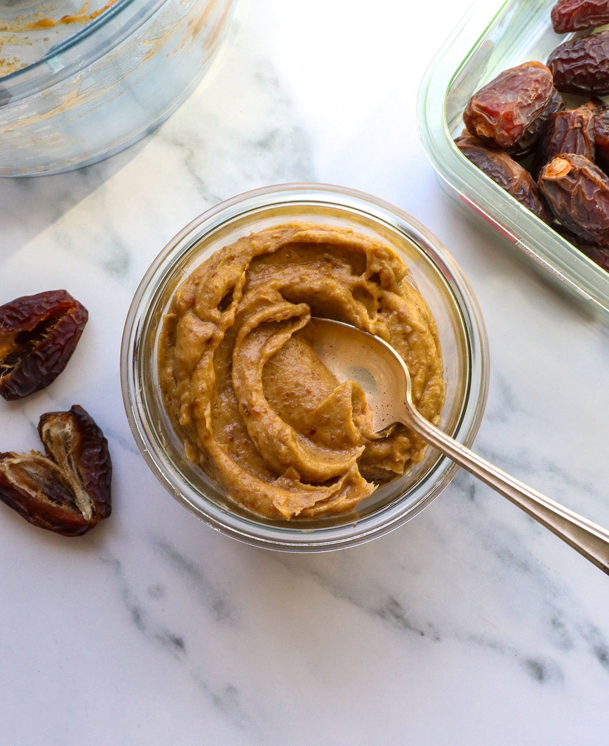 date paste in a jar with a spoon. 