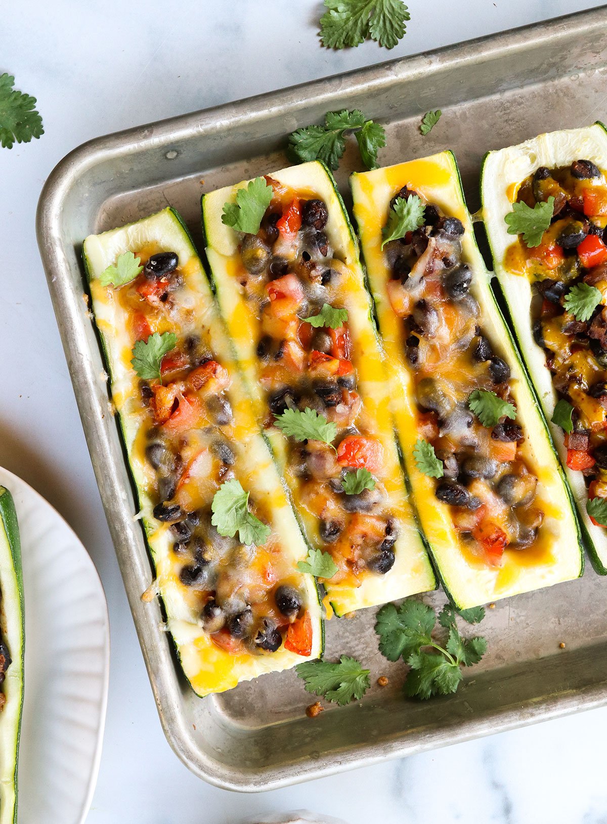 melted cheese on vegetarian zucchini boats.