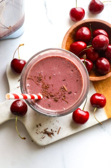 chocolate cherry smoothie overhead near a bowl of cherries.