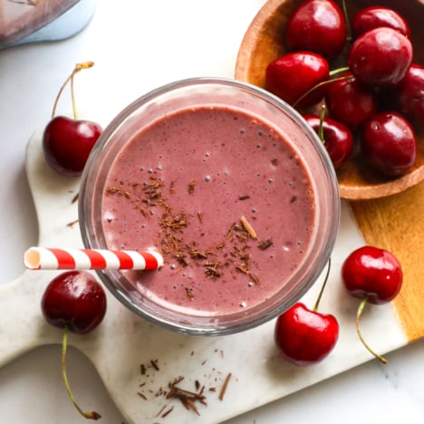chocolate cherry smoothie overhead near a bowl of cherries.