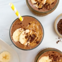 chocolate peanut butter banana smoothie overhead in glasses