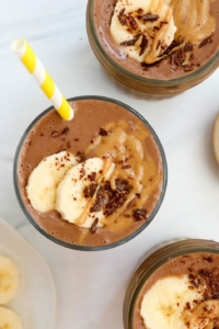 chocolate peanut butter banana smoothie overhead in glasses