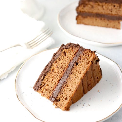 Slice of Healthy birthday cake with chocolate ganache