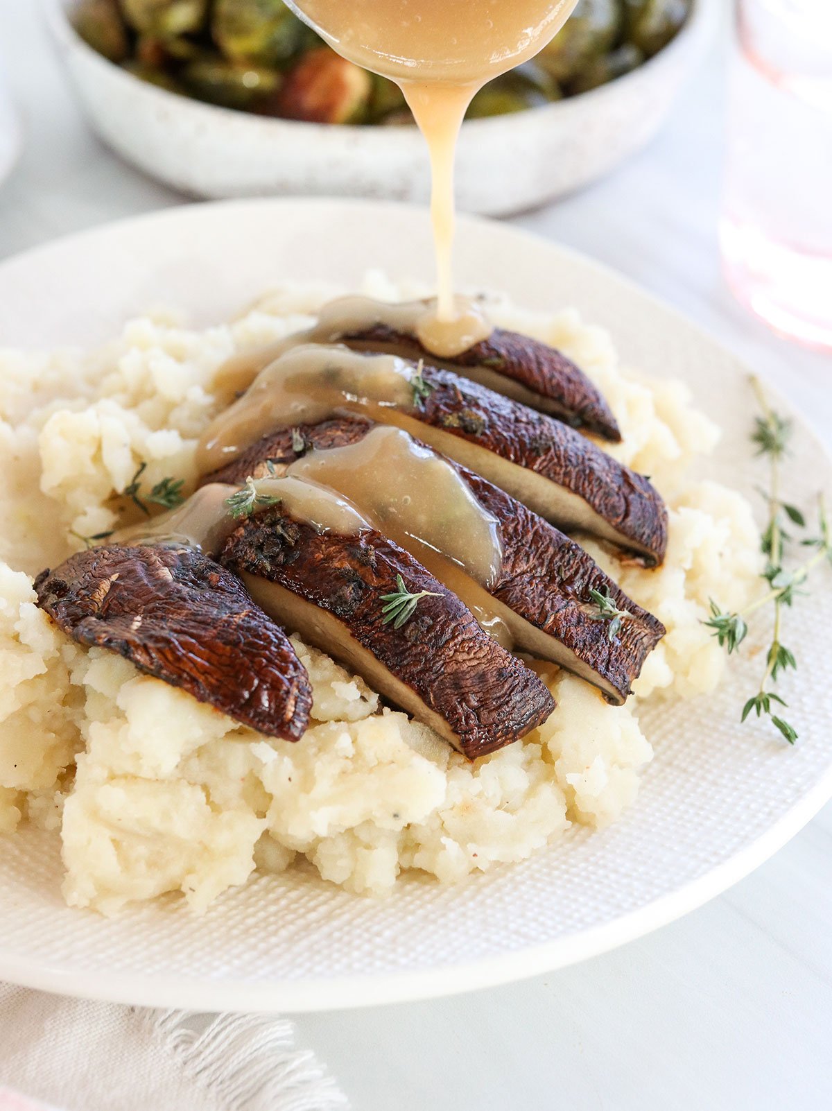 gravy poured over baked portobello mushroom.