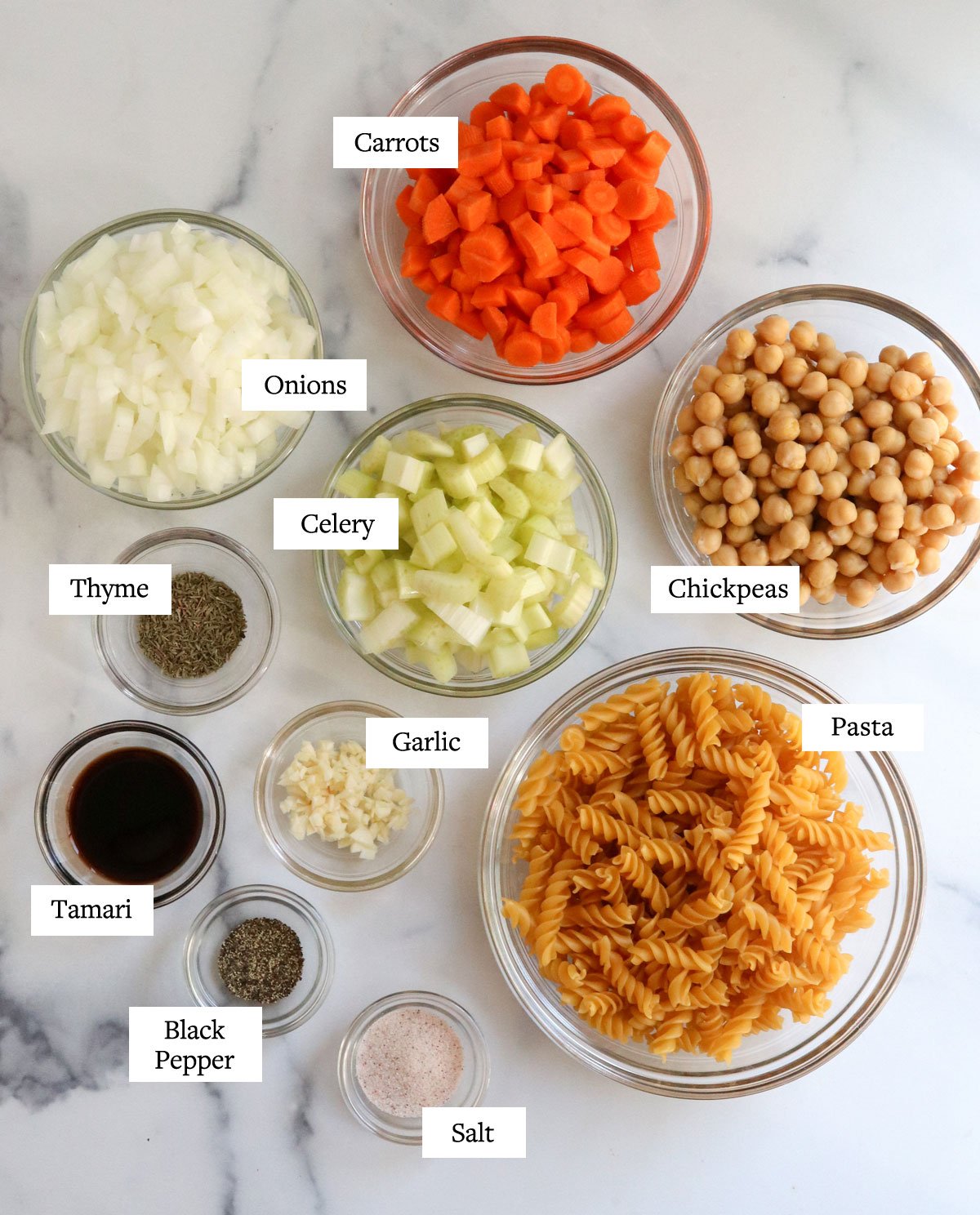 chickpea noodle soup ingredients in glass bowls