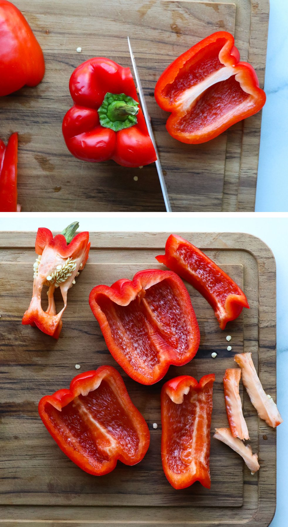 red bell pepper sliced with seeds removed on a cutting board. 