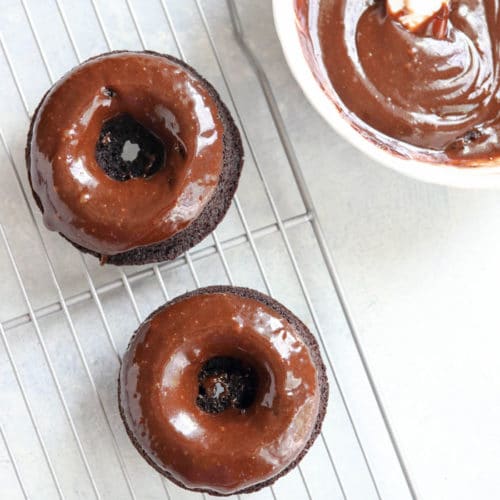 chocolate donuts on wire rack