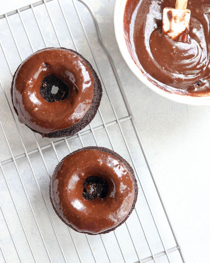 chocolate donuts on wire rack