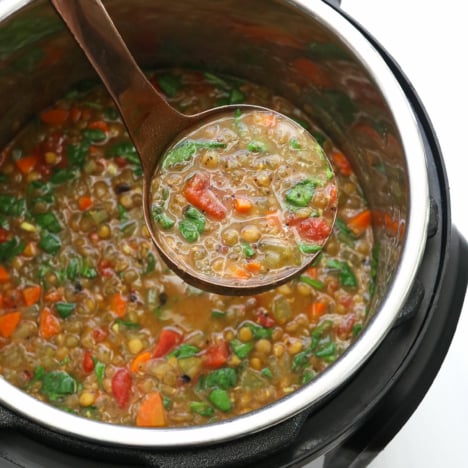 ladle of lentil soup over Instant pot.