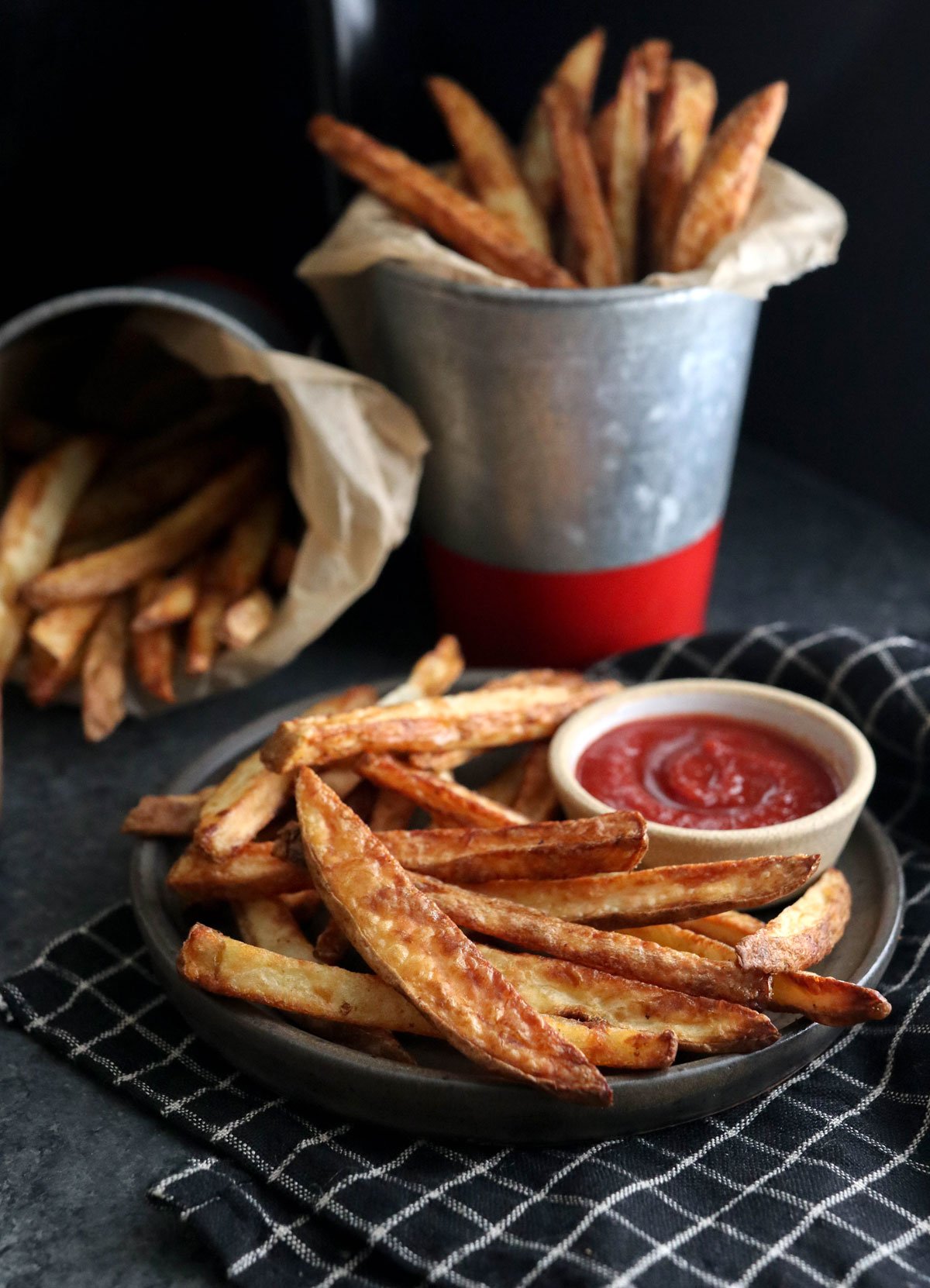 air fryer fries on black plate