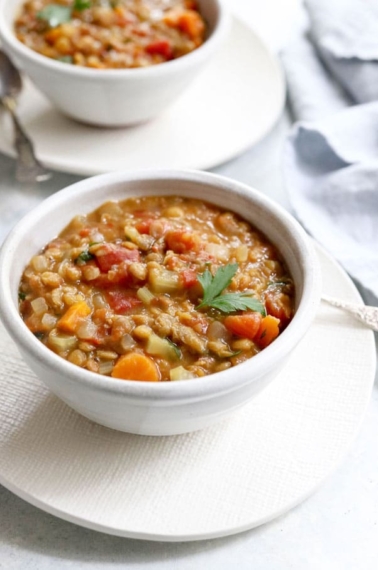 Instant Pot lentil soup in a white bowl
