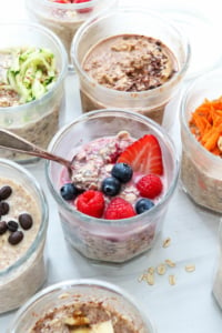 overnight oats with different toppings and flavors in glass jars