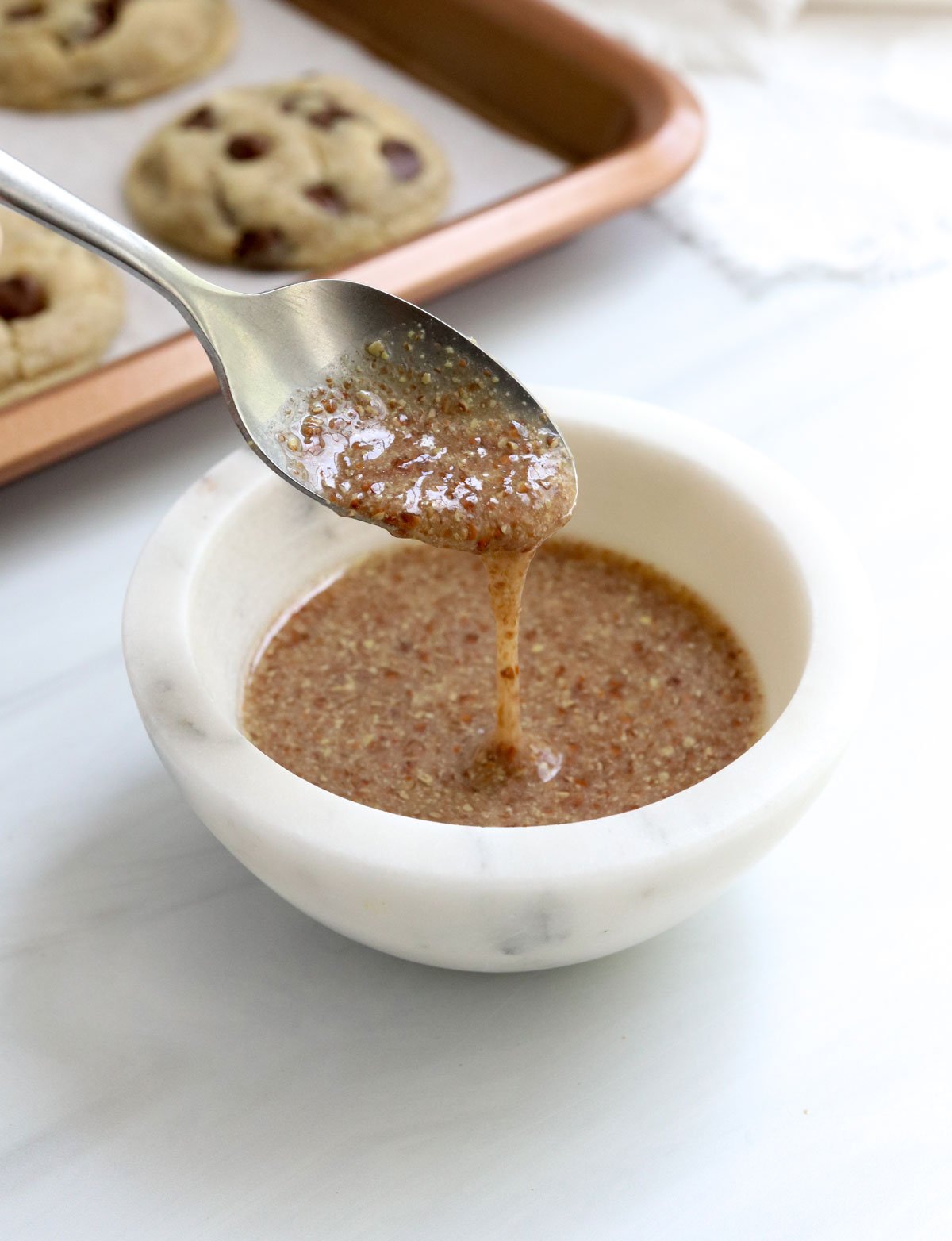 flax egg dripping off a spoon.