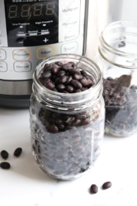 plain black beans in glass storage jars