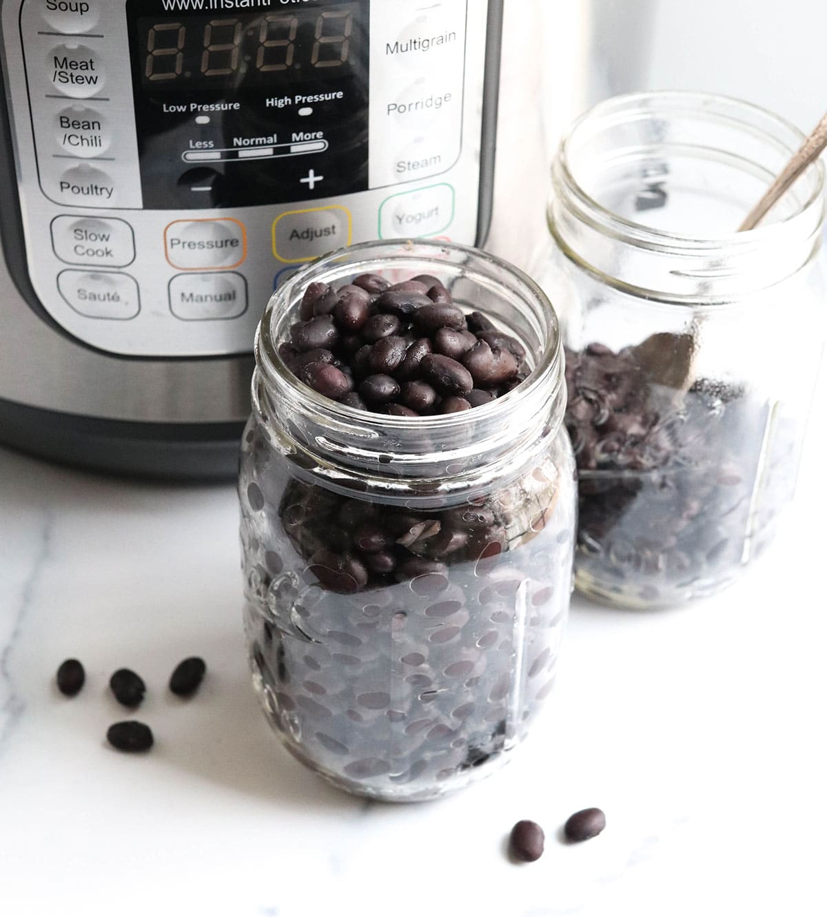 plain black beans in glass storage jars