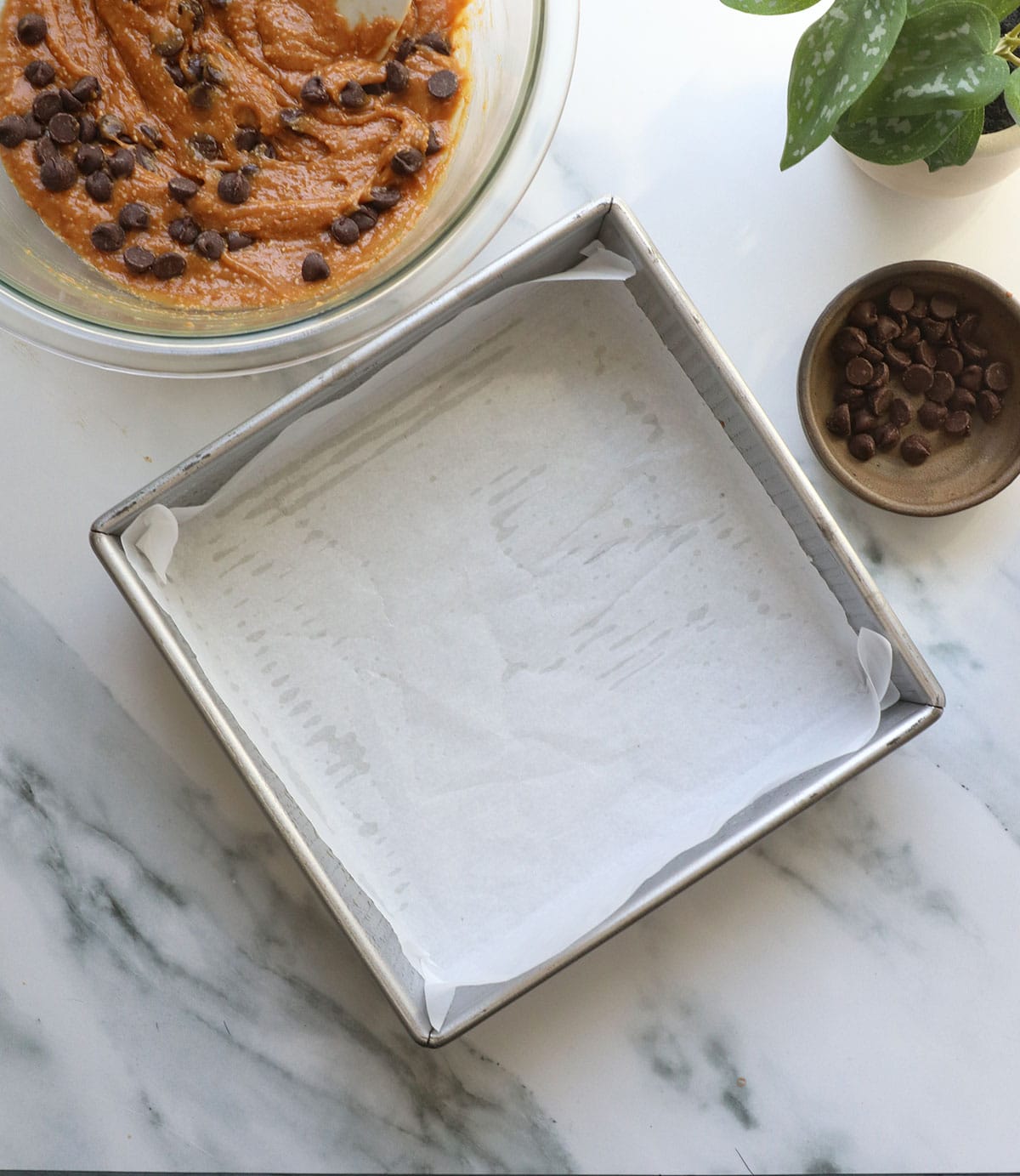 square pan lined with parchment paper.