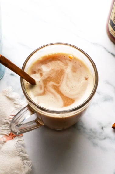healthy london fog latte in a glass mug with a spoon.