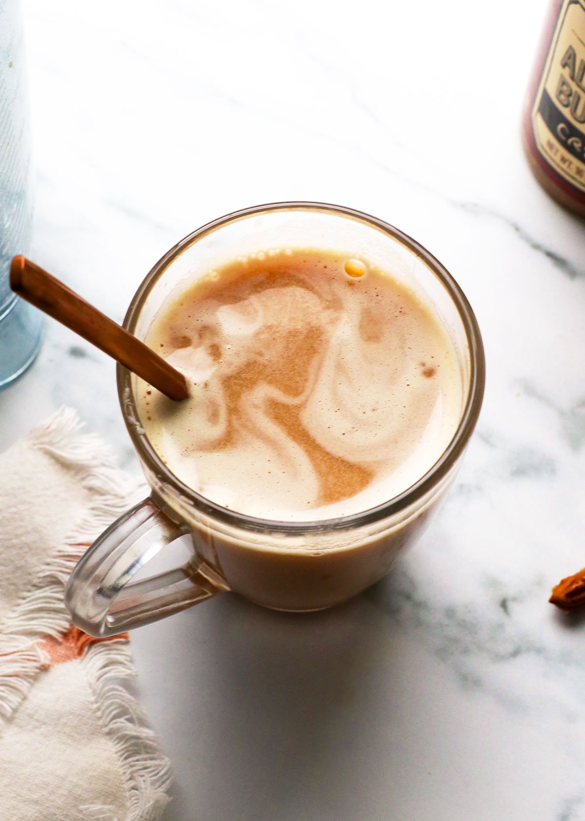 healthy london fog latte in a glass mug with a spoon.
