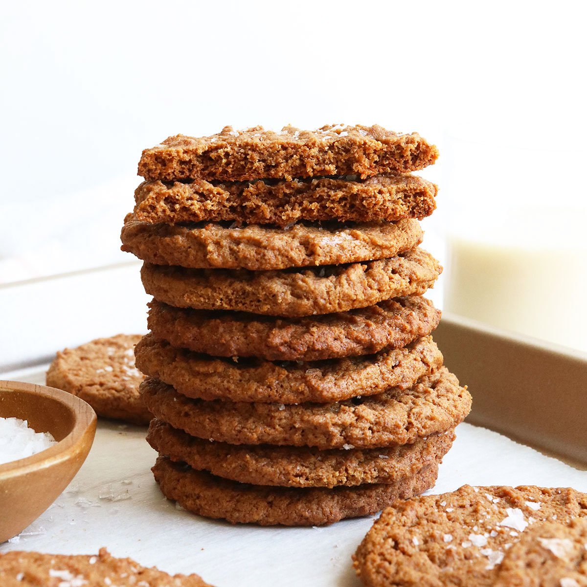 almond butter cookies stacked with the top one split in half.