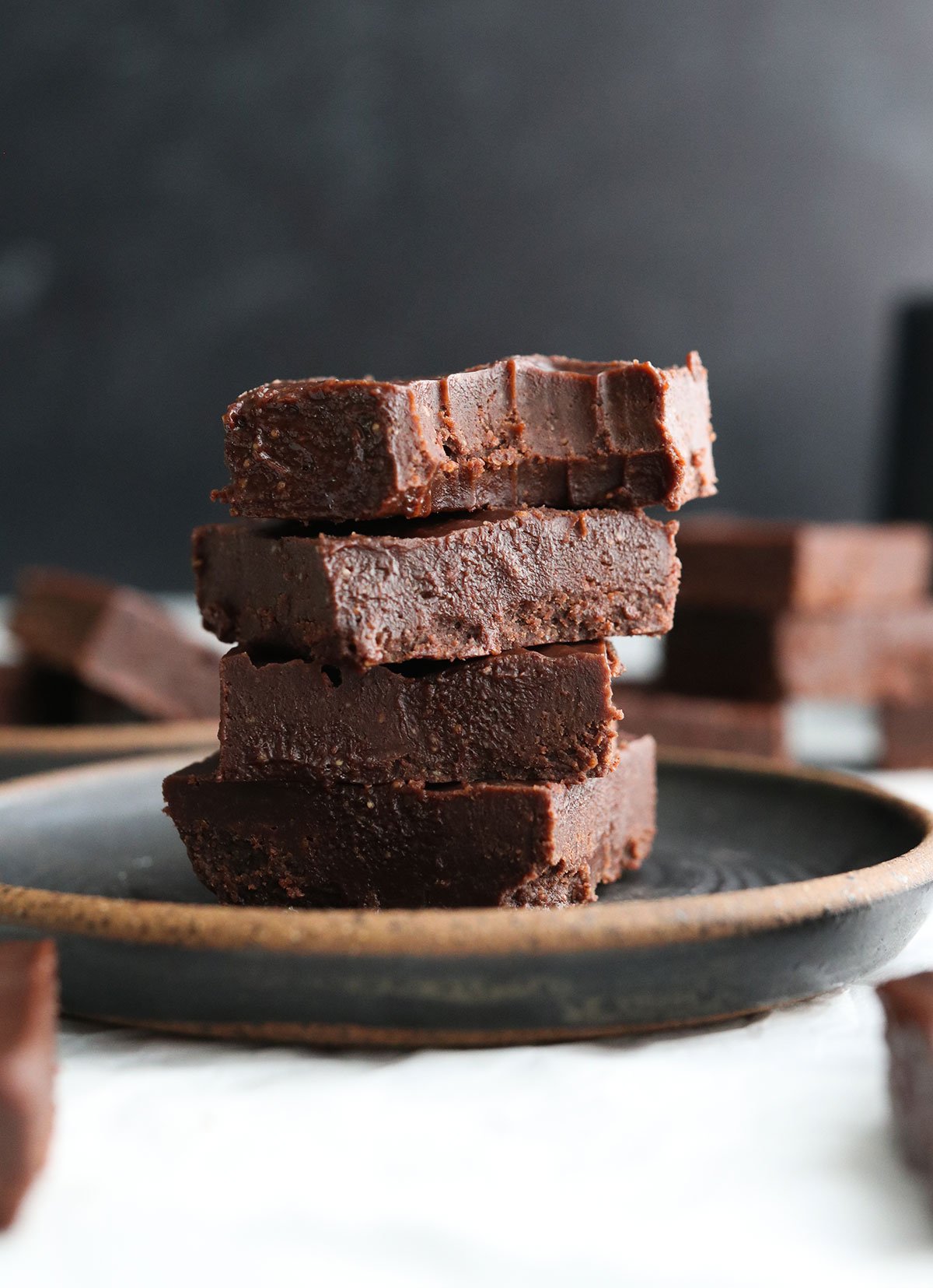 fudge stacked with a bite taken out of the top piece.