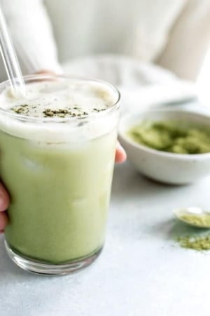 matcha latte in a glass on white