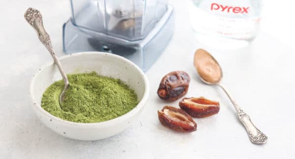 matcha latte ingredients on a white counter