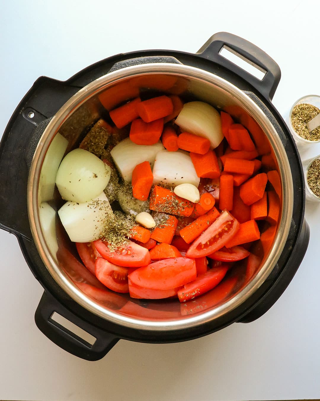 raw veggies added to the bowl of the Instant Pot. 