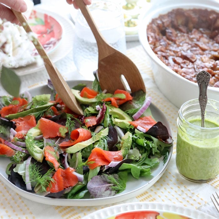 salmon salad with tongs