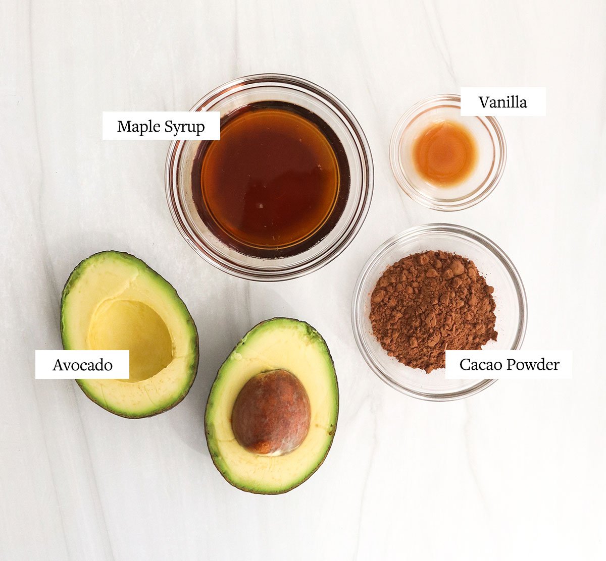 avocado pudding ingredients labeled in glass bowls.