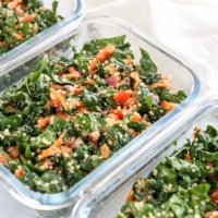 kale quinoa salad in meal prep containers
