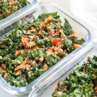 meal prep containers with kale quinoa salad