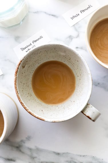 coffee with dairy free creamer inside a white mug.