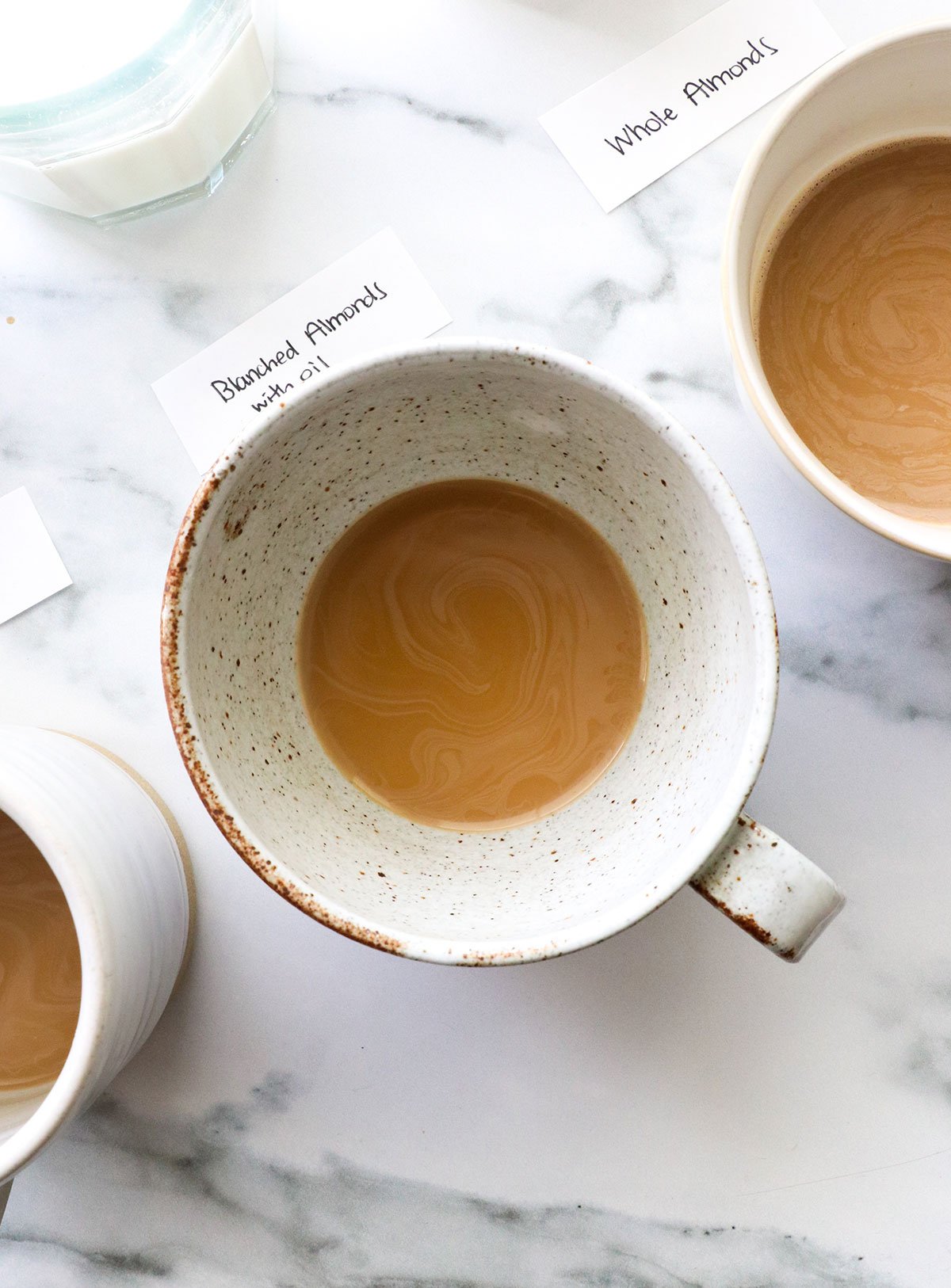 coffee with dairy free creamer inside a white mug.
