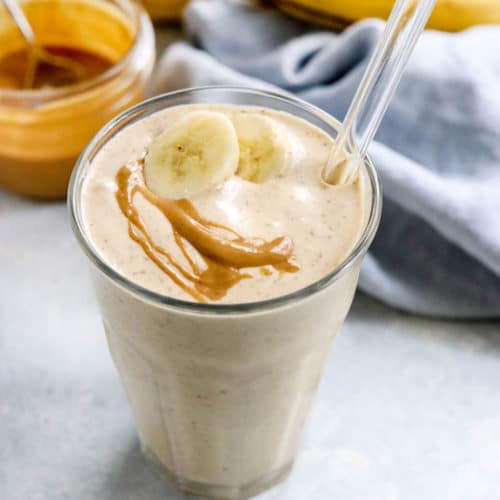 peanut butter banana smoothie with banana slice on top