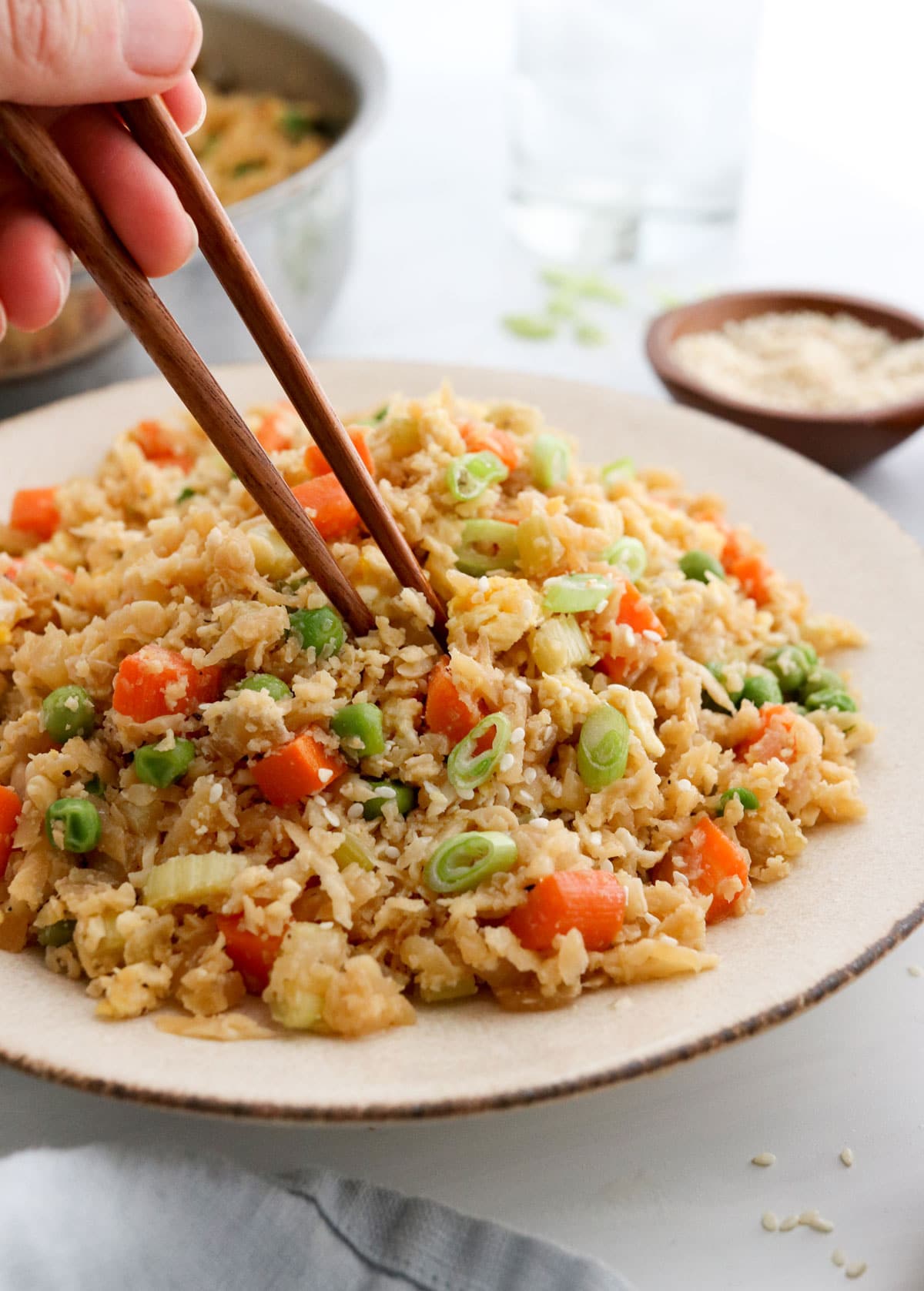 cauliflower rice served with chopsticks.