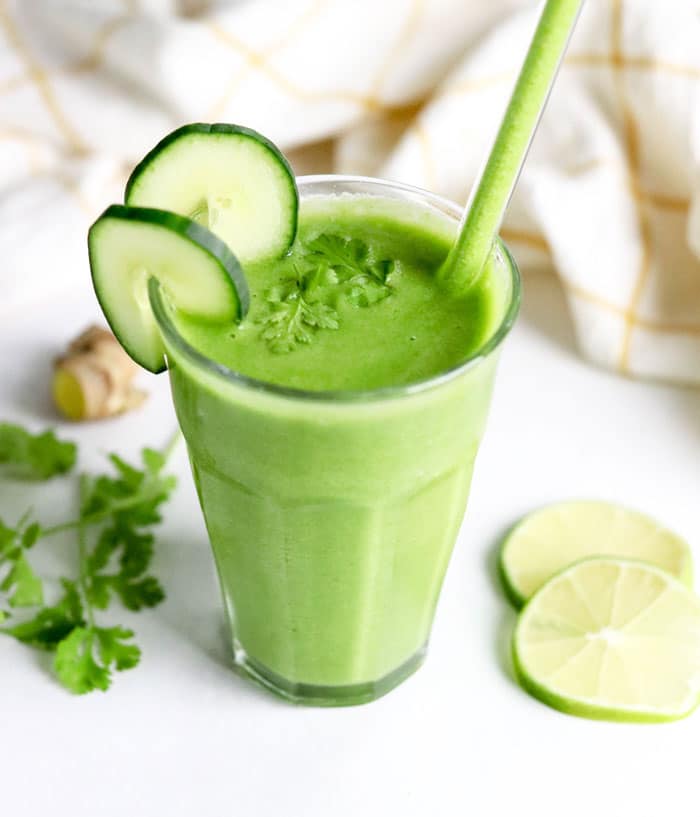 green detox smoothie with limes cilantro and cucumber