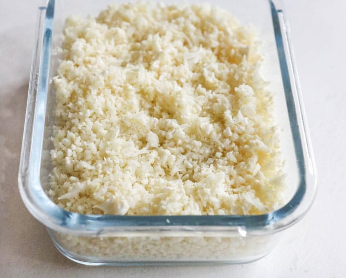 frozen cauliflower rice in glass container