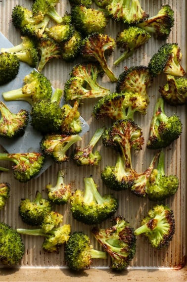 roasted broccoli on a baking sheet.