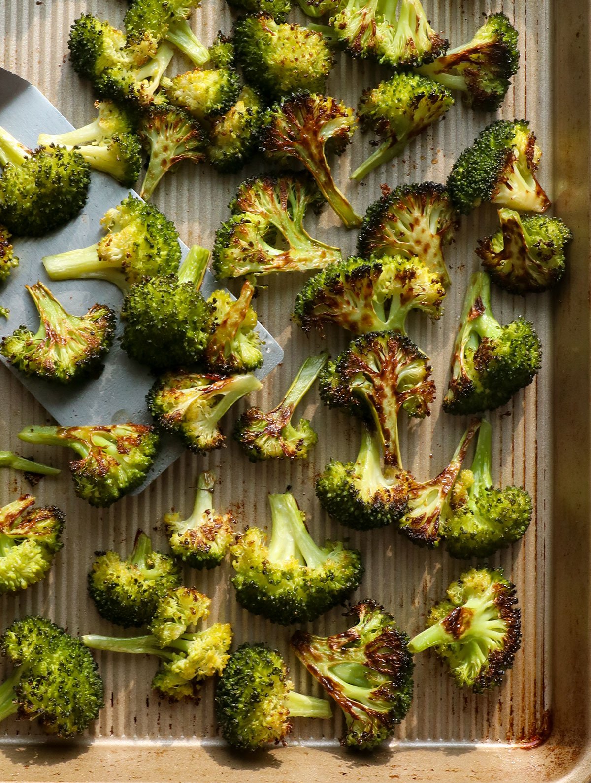 roasted broccoli on a baking sheet. 