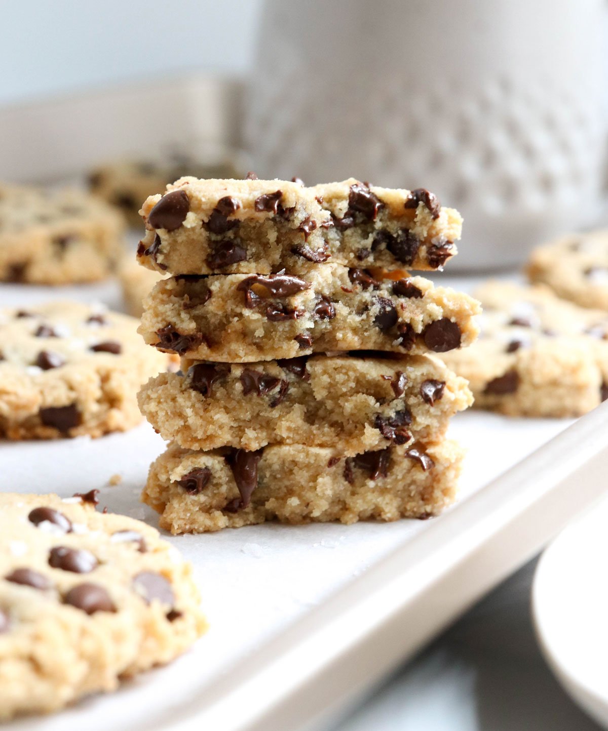 almond flour cookies stacked on a pan