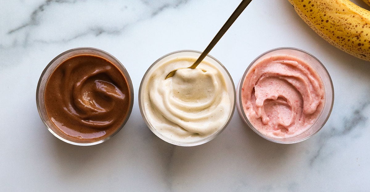 chocolate, vanilla, and strawberry banana ice cream in glass bowls.