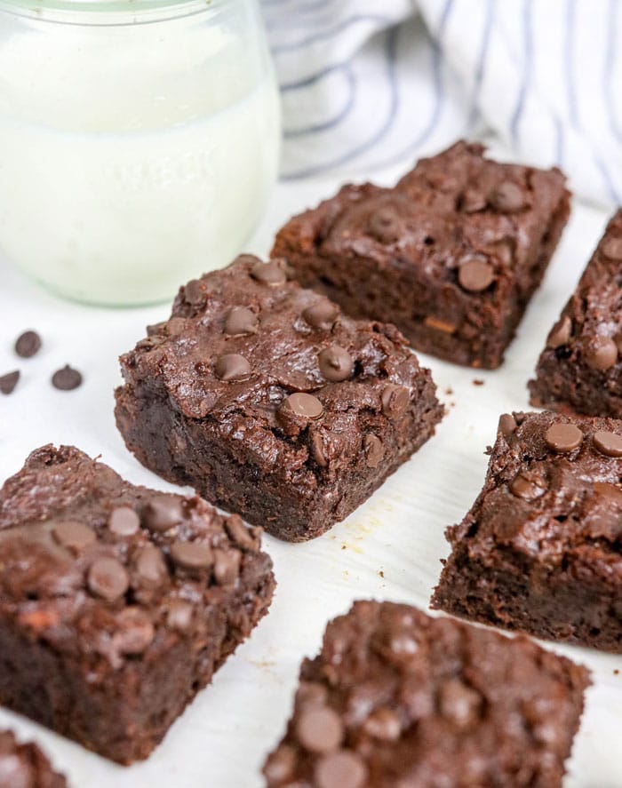 sweet potato brownies cut into squares with almond milk